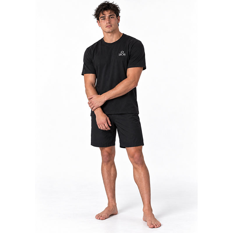 Front view of the Subora Sunwash Tee in Black on a male model, showing the white Subora logo chest print