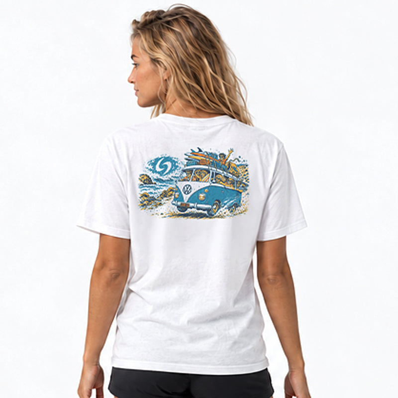 Back view of the Subora Tripp'en Tee in White on a female model, showing the hand-drawn back print of a kombi loaded with surfboards and a crew of friends driving along the coast past a Subora S wave