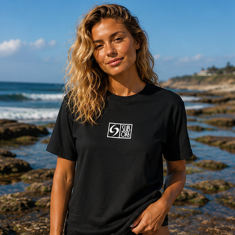 subora, subora surf, Subora Surf Co,  living in the moment, shiggles, surf, surfing, beach, swimwear, summer, tshirt, Subora  Ombak logo Tee Black, Ombak, womens surf tshirt, womens surf tee australia, womens beach tshirt,
womens coastal tshirt, womens black surf tee, australian surfwear womens tshirt, womens oversized surf tshirt, womens casual beach tee, womens lifestyle surf tshirt, womens graphic surf tee, long sleeve tshirt, short sleeve tshirt 